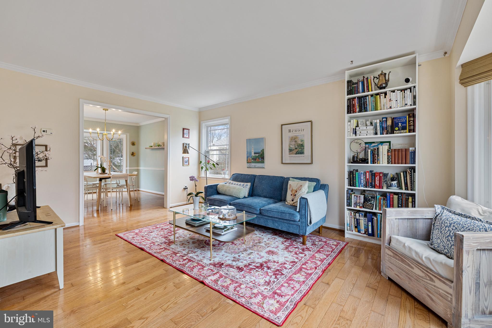 1439 Millikens Bend Road Herndon, VA 20170 - Photo 45 of 46 a living room with furniture and a book shelf