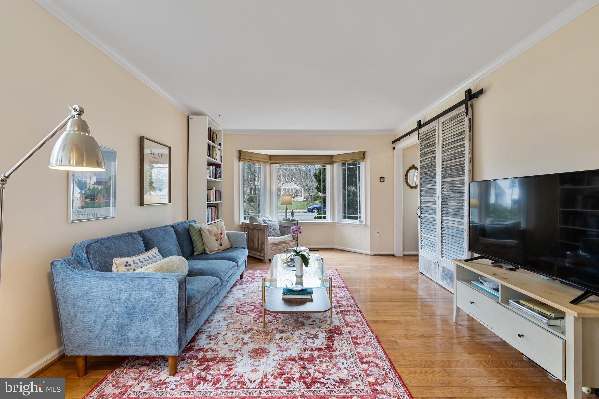 1439 Millikens Bend Road Herndon, VA 20170 - Photo 46 of 46 a living room with furniture and a flat screen tv