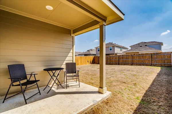 a view of a terrace with chairs