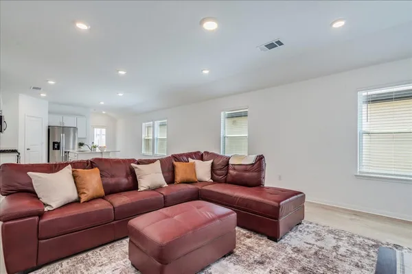 a living room with furniture and a window