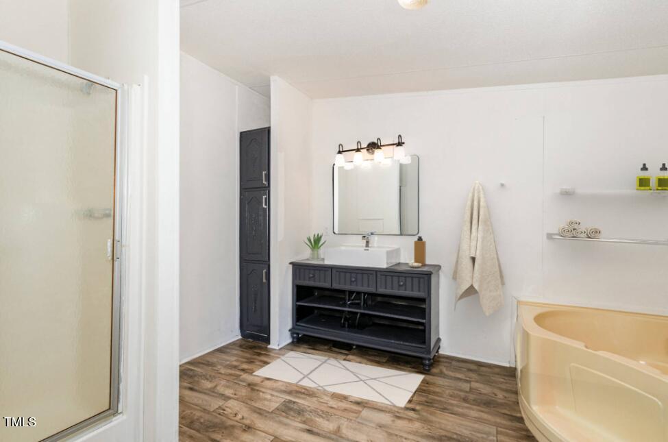 548 Riddle Avenue Hillsborough, NC 27278 - Photo 5 of 12 a bathroom with a bathtub sink and toilet