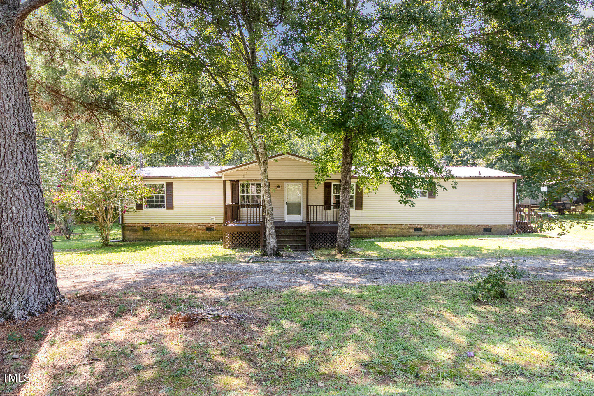 548 Riddle Avenue Hillsborough, NC 27278 - Photo 8 of 12 a view of a house with backyard and a tree