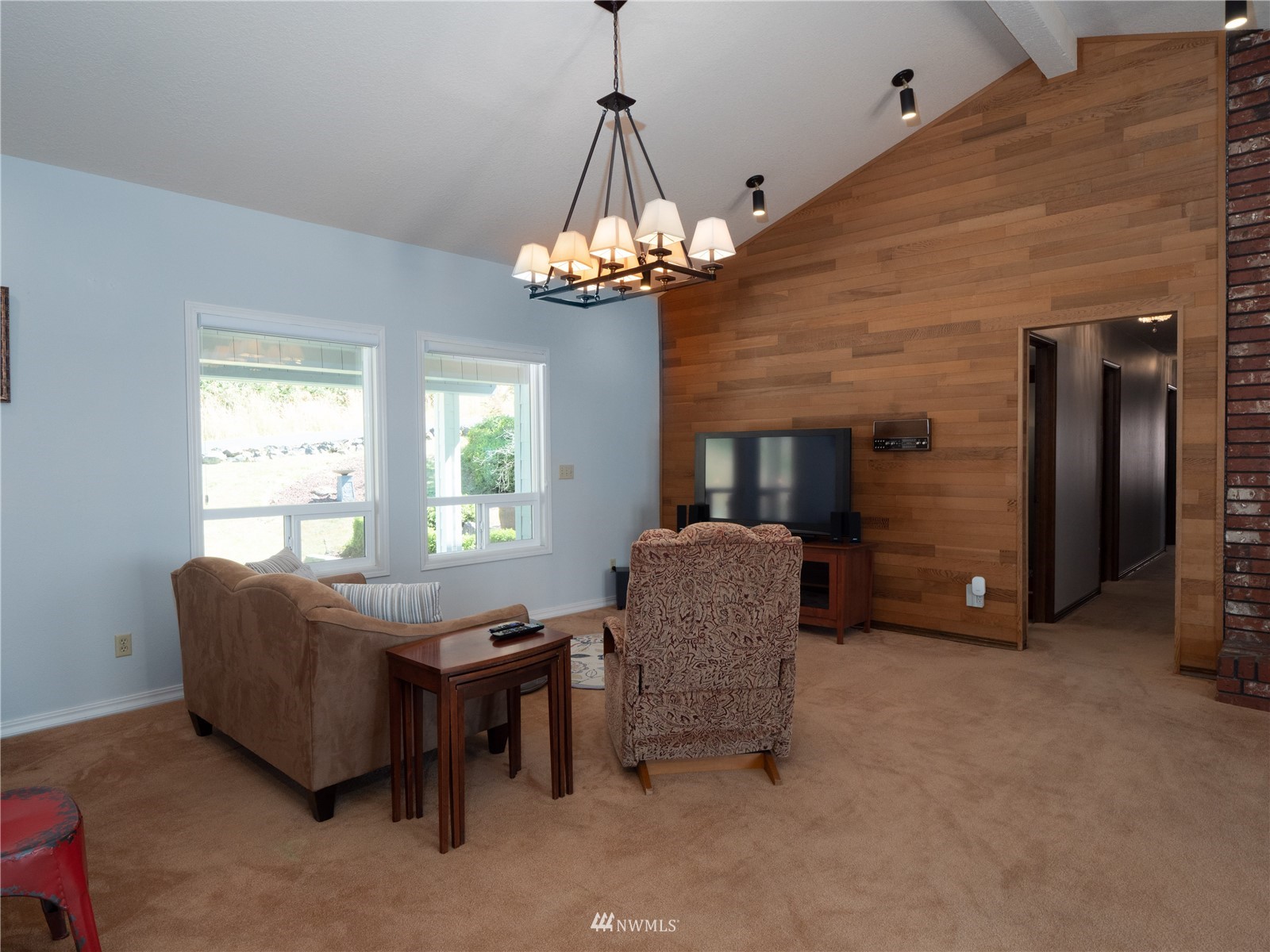 25 Alpine Way Longview, WA 98632 - Photo 17 of 30 a living room with furniture and a chandelier