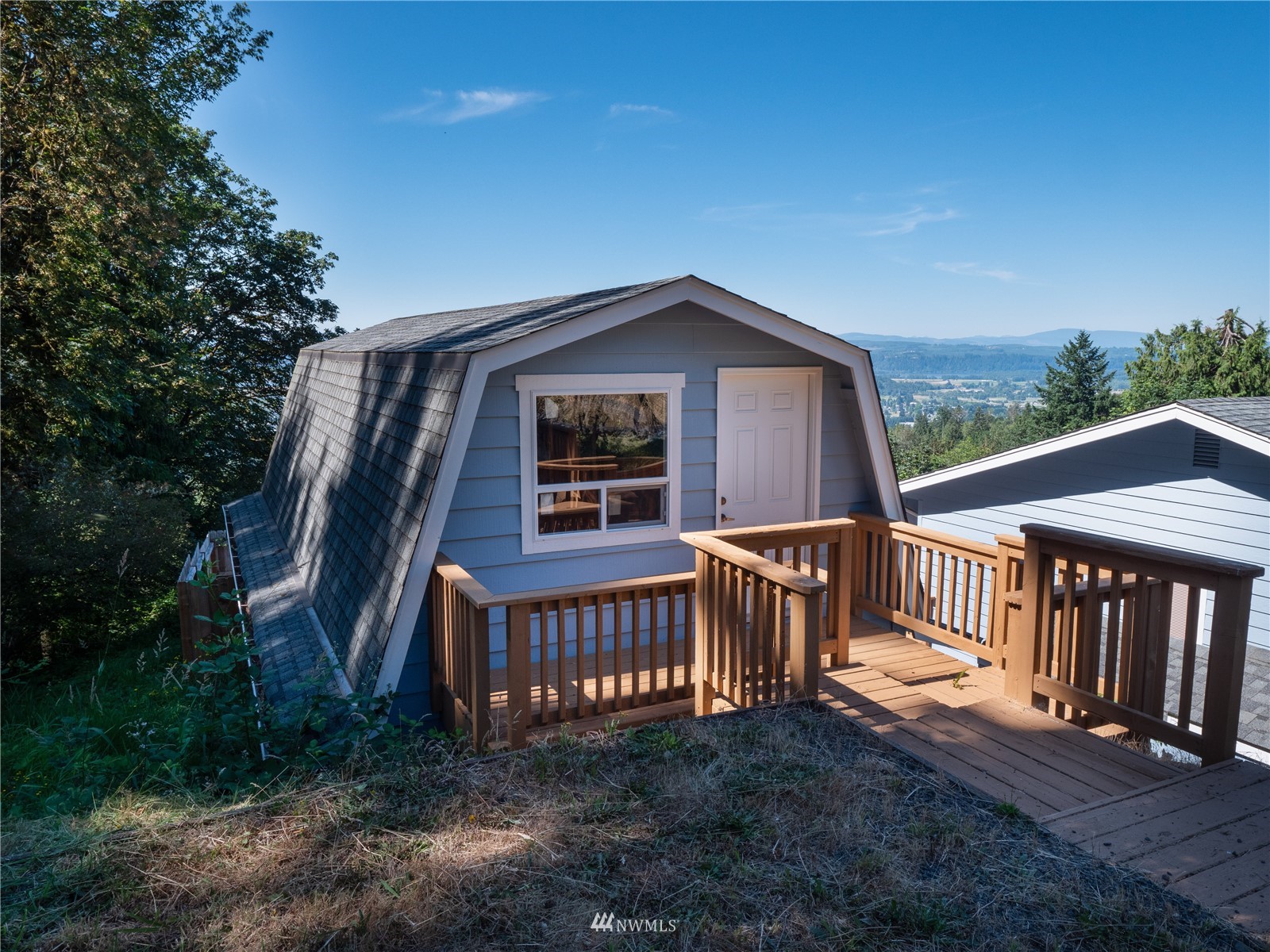 25 Alpine Way Longview, WA 98632 - Photo 10 of 30 a view of a wooden house with a yard