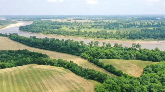 a view of a lake with a yard