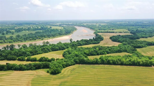 a view of a lake with a big yard