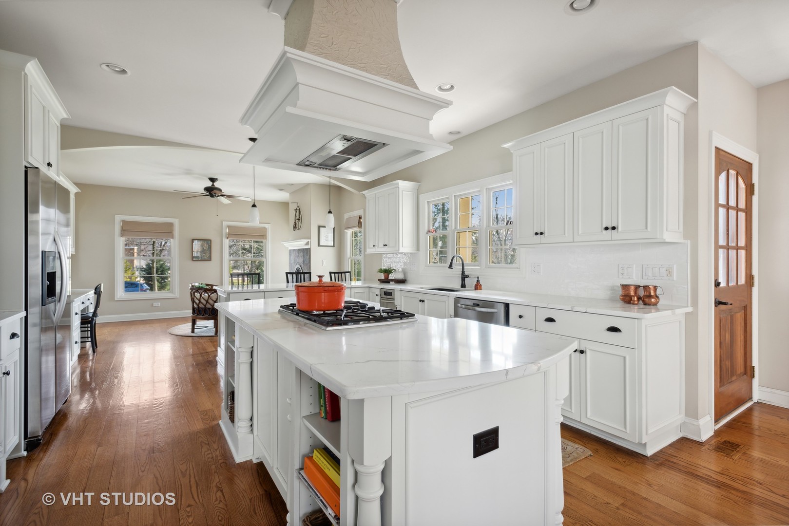 1044 Golf Lane Wheaton, IL 60189 - Photo 11 of 43 a kitchen with stainless steel appliances sink stove refrigerator and wooden floor