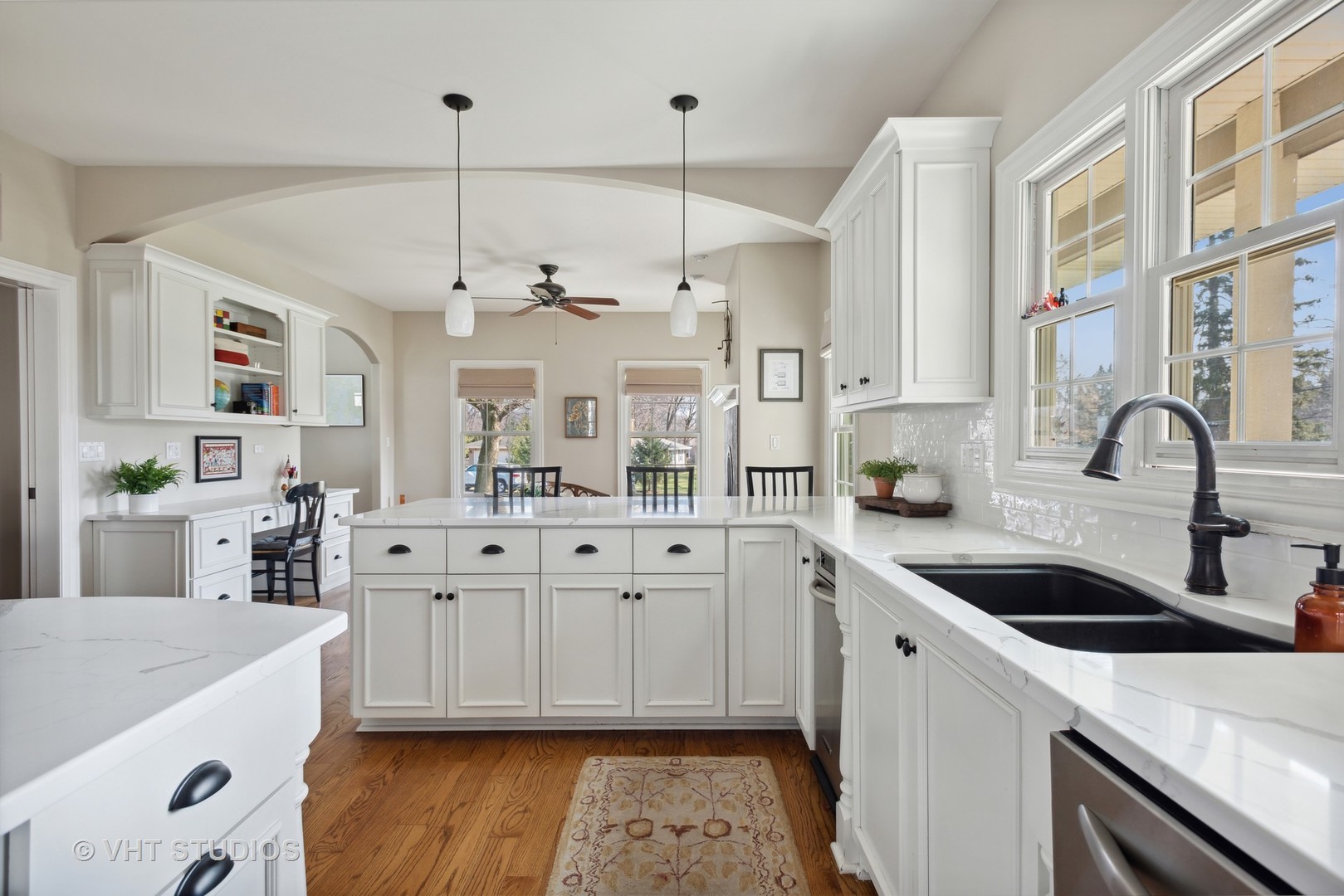1044 Golf Lane Wheaton, IL 60189 - Photo 12 of 43 a kitchen with granite countertop a sink a stove and cabinets