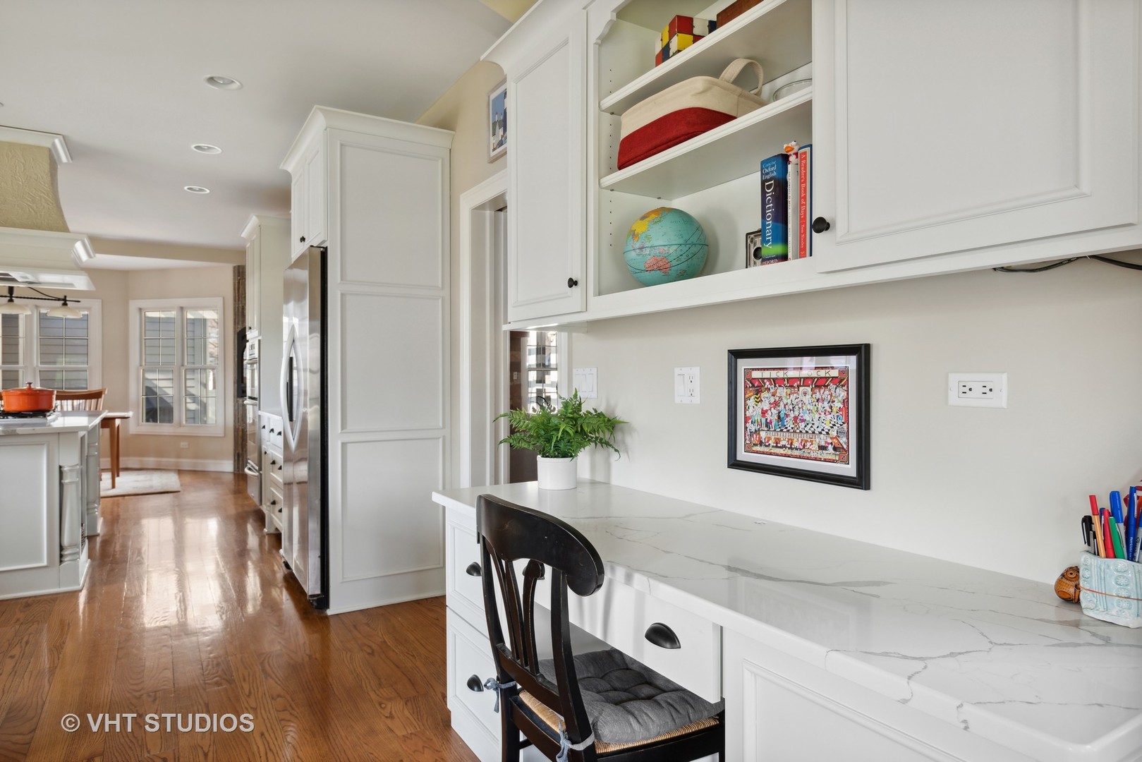 1044 Golf Lane Wheaton, IL 60189 - Photo 16 of 43 a view of a hallway with workspace and a potted plant