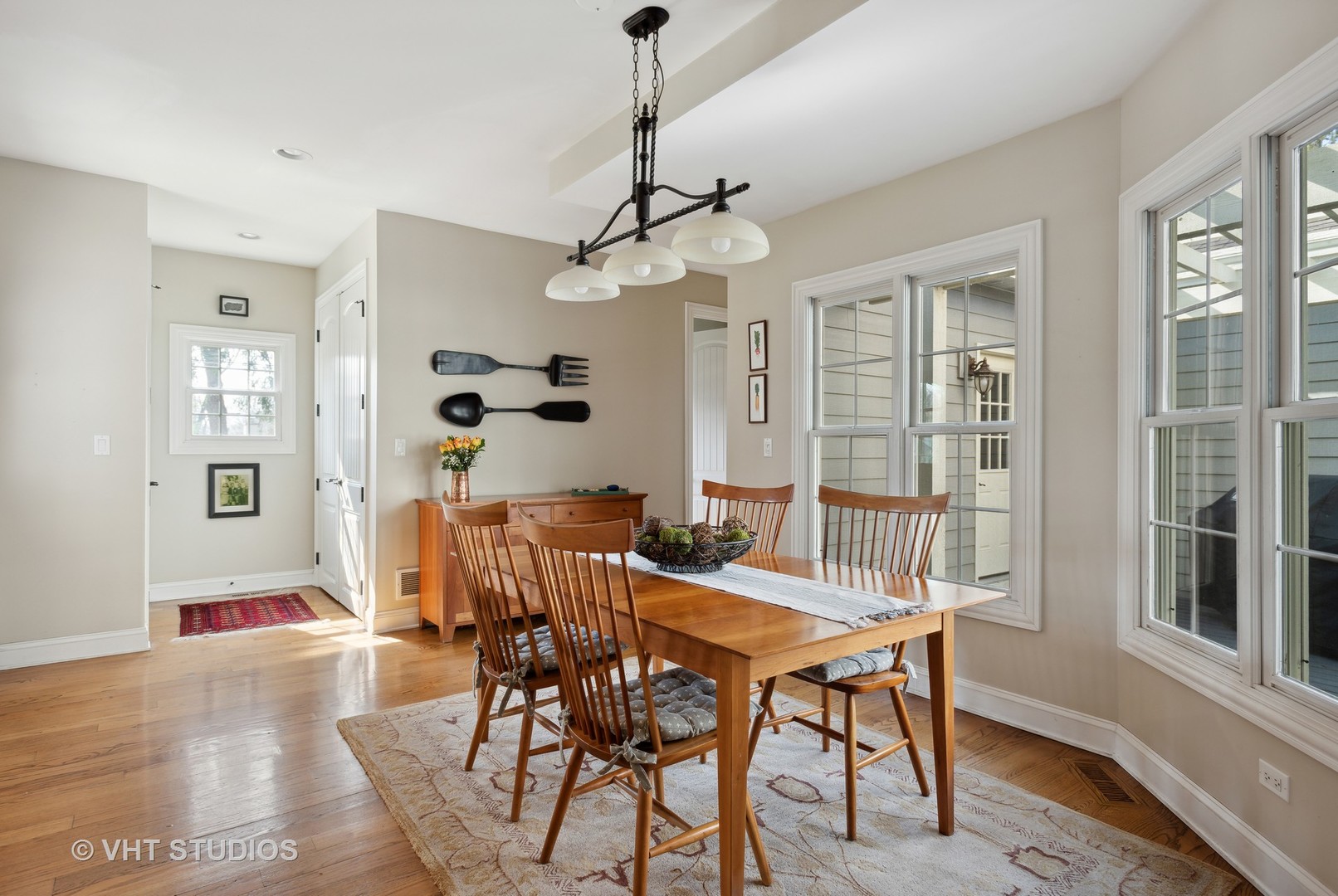 1044 Golf Lane Wheaton, IL 60189 - Photo 19 of 43 a view of a dining room with furniture window and wooden floor