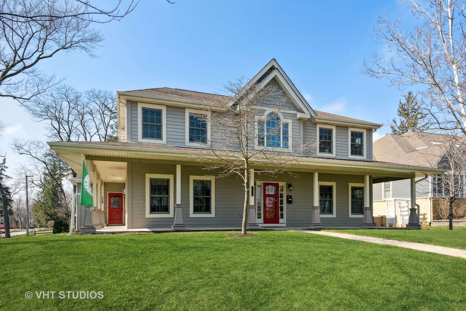 1044 Golf Lane Wheaton, IL 60189 - Photo 2 of 43 front view of a brick house with a yard