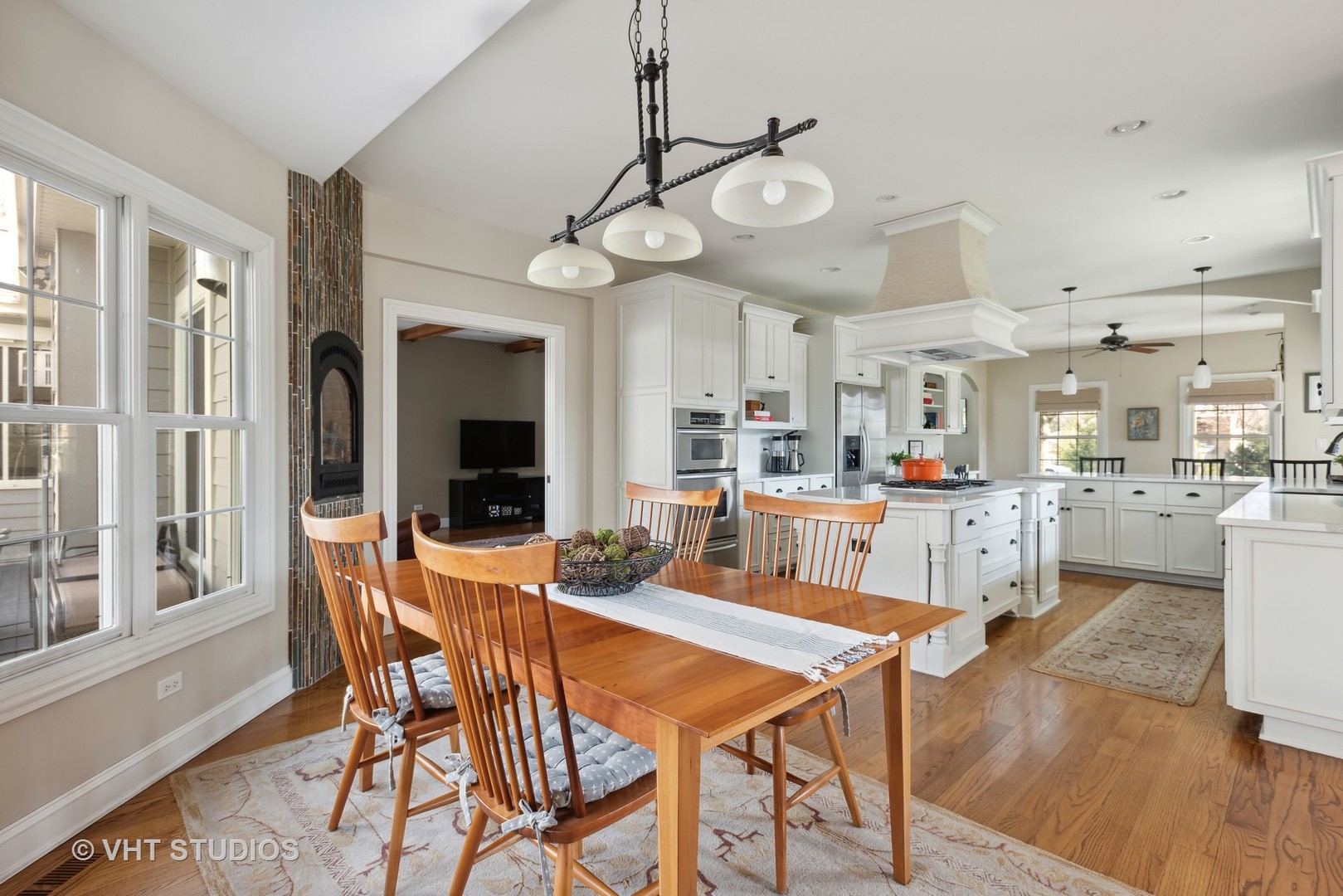 1044 Golf Lane Wheaton, IL 60189 - Photo 21 of 43 a view of a dining room with furniture and a large window