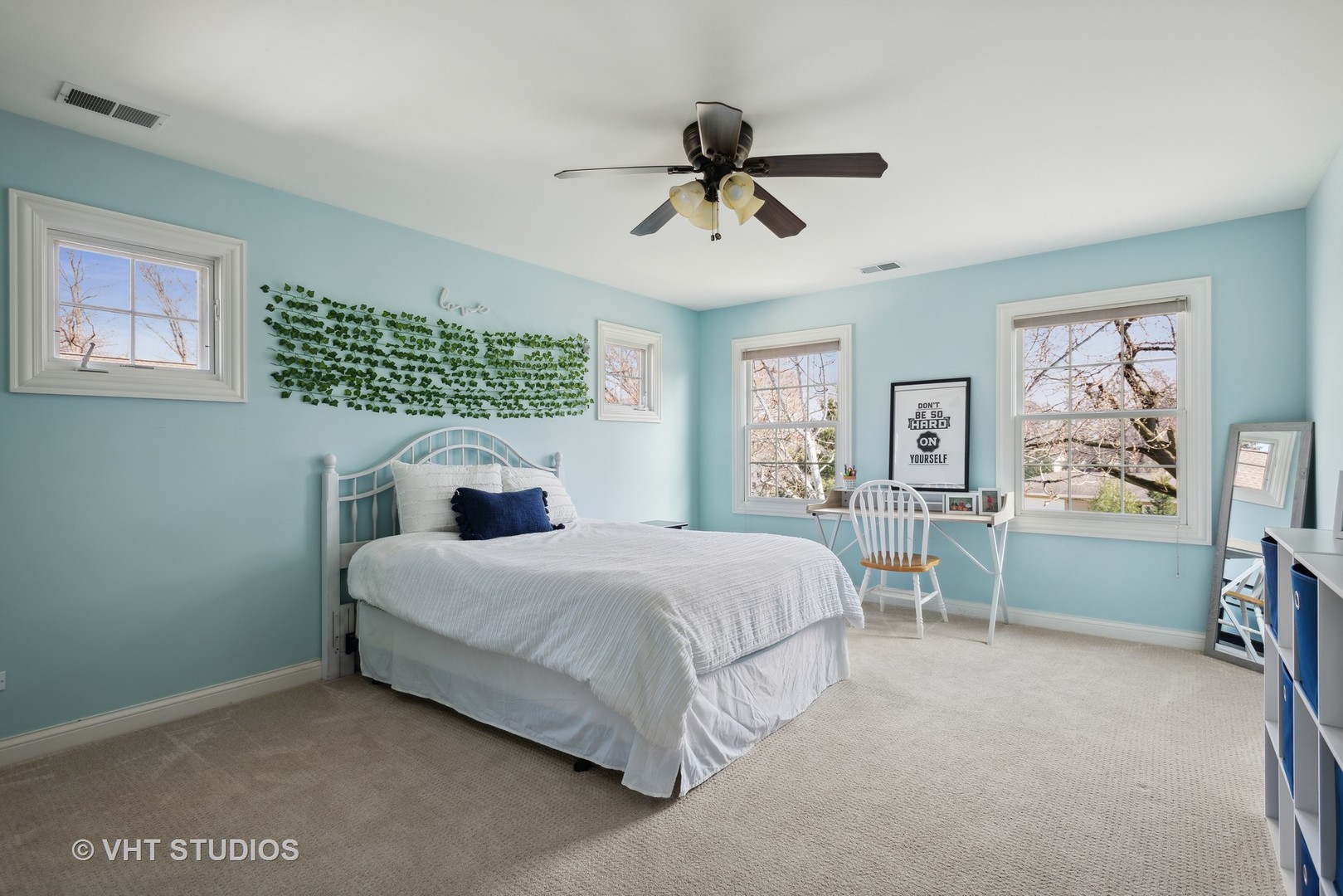 1044 Golf Lane Wheaton, IL 60189 - Photo 28 of 43 a bedroom with a bed and a chandelier