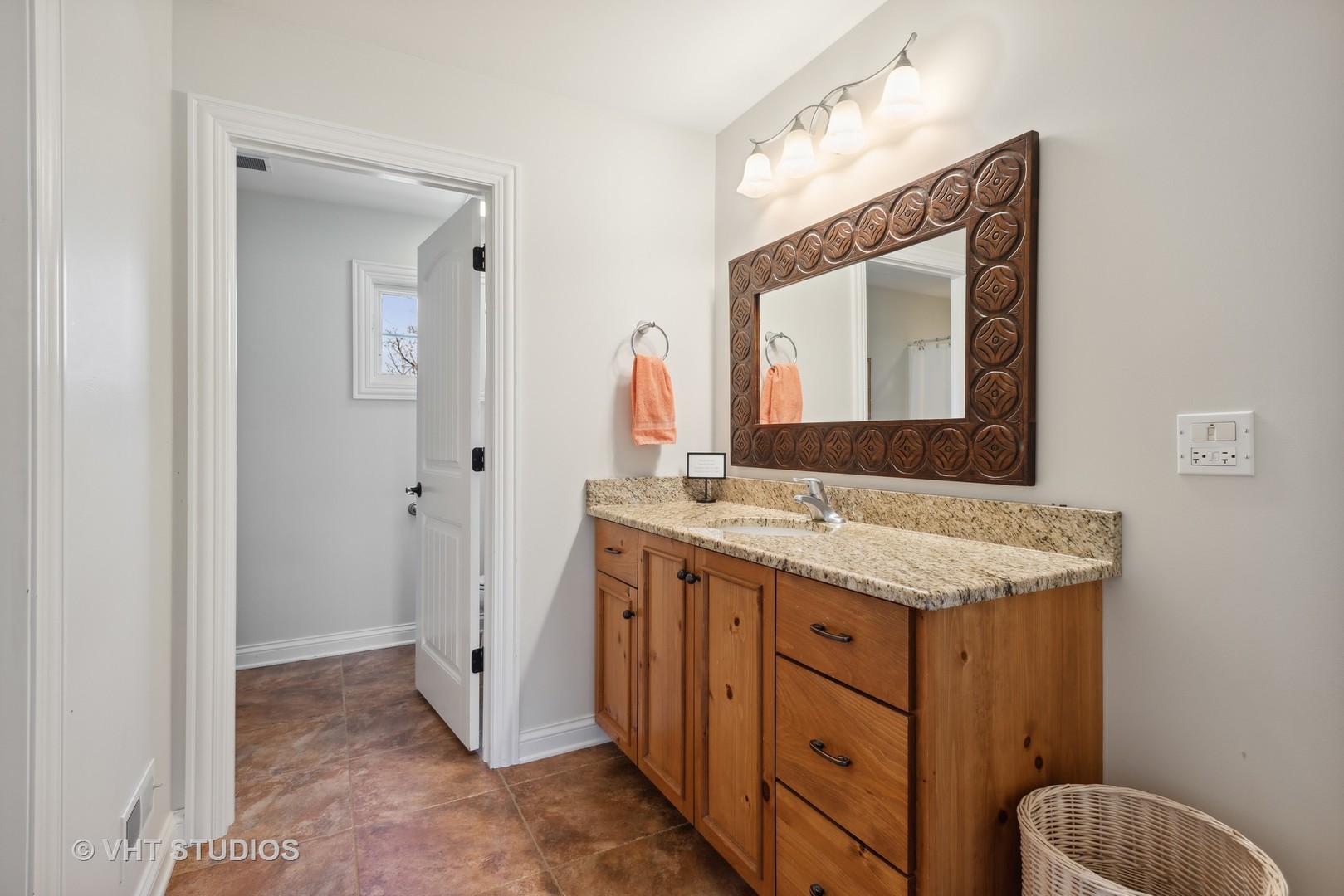 1044 Golf Lane Wheaton, IL 60189 - Photo 29 of 43 a bathroom with a granite countertop sink and a mirror