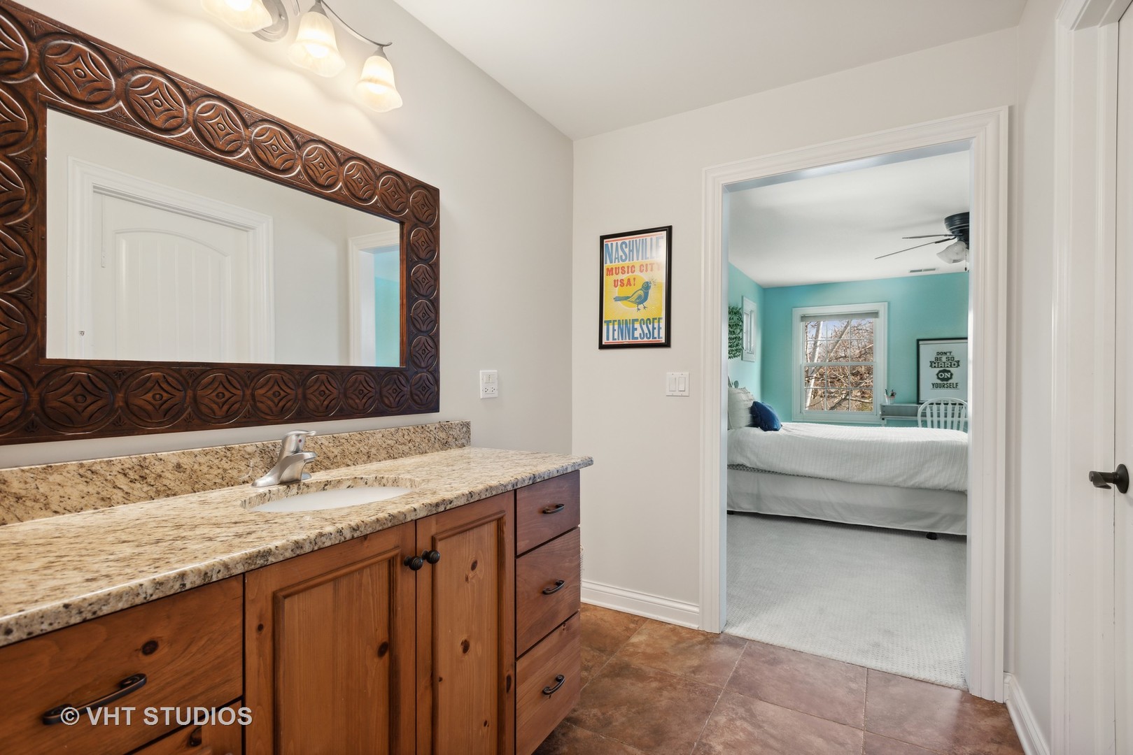 1044 Golf Lane Wheaton, IL 60189 - Photo 30 of 43 a en suite bathroom with a granite countertop sink and a mirror