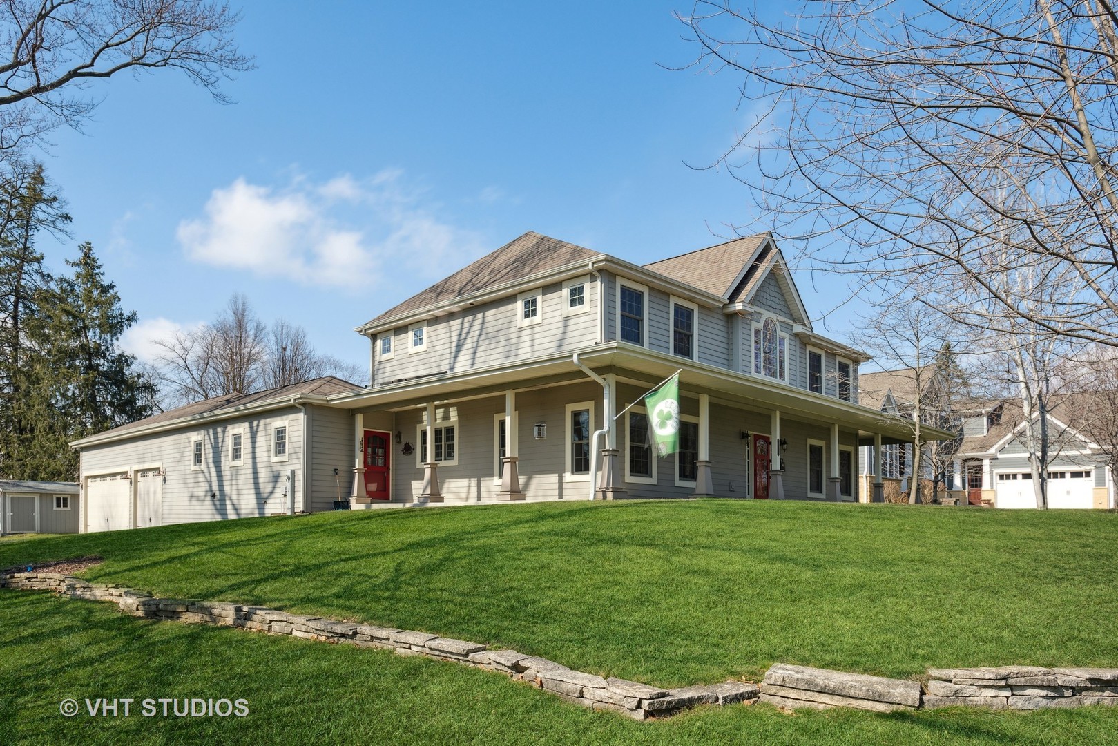 1044 Golf Lane Wheaton, IL 60189 - Photo 3 of 43 a front view of a house with a garden
