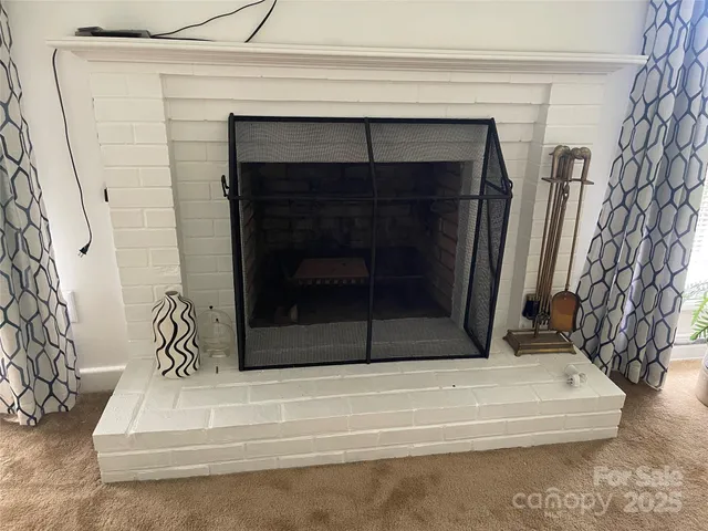 a white building with a fireplace