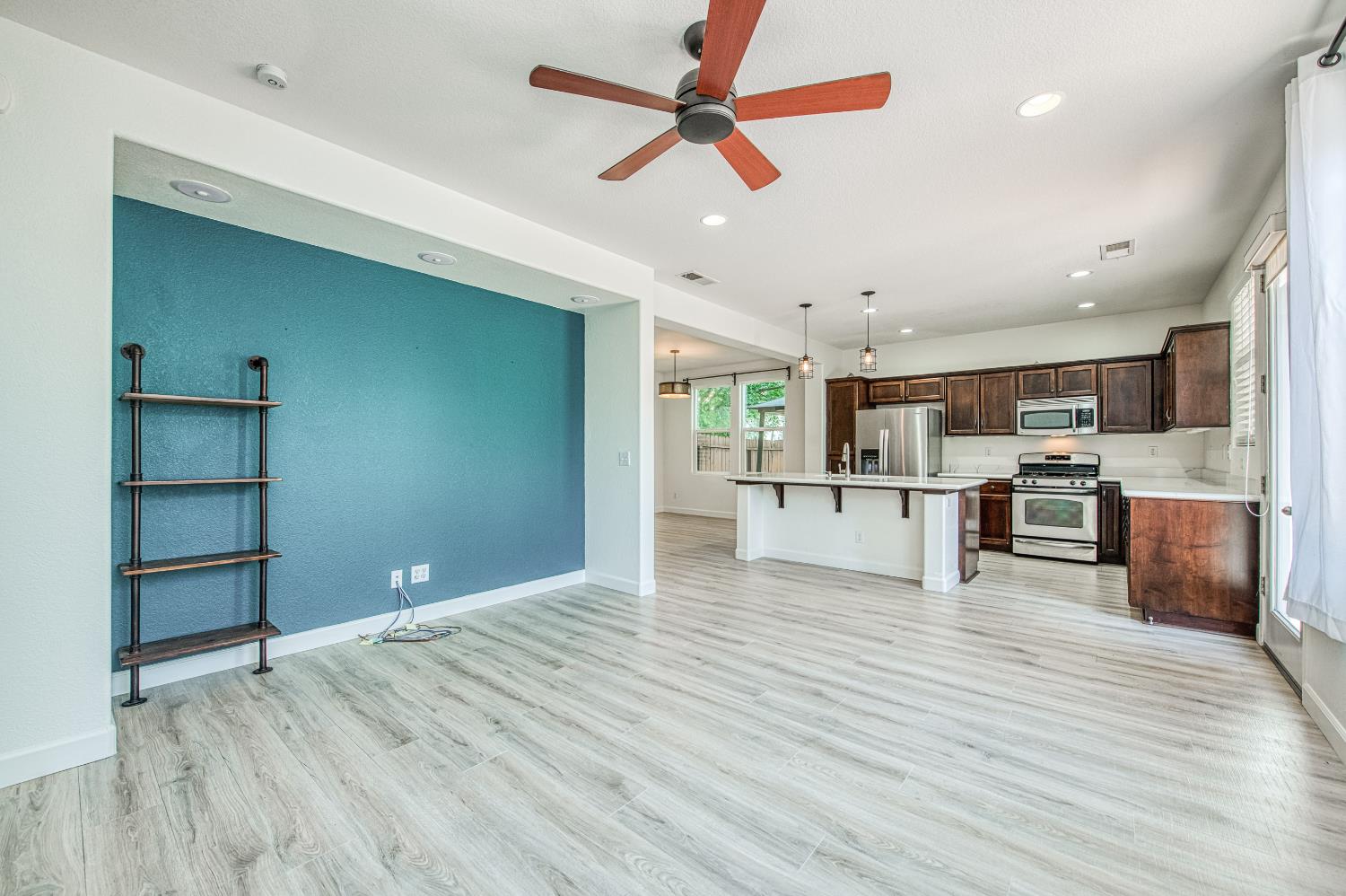 487 Everglade Avenue Clovis, CA 93619 - Photo 9 of 28 a view of kitchen with cabinets and wooden floor
