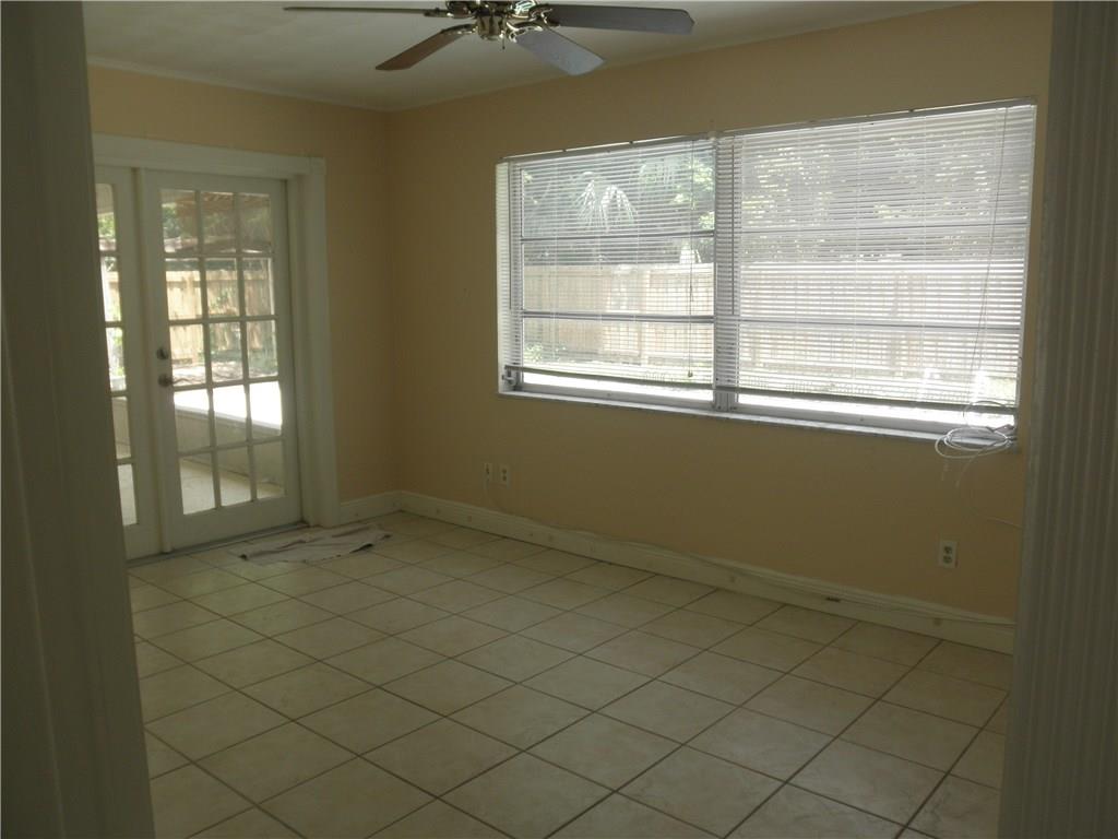 540 South Manor Drive Stuart, FL 34994 - Photo 12 of 22 an empty room with a empty space and windows