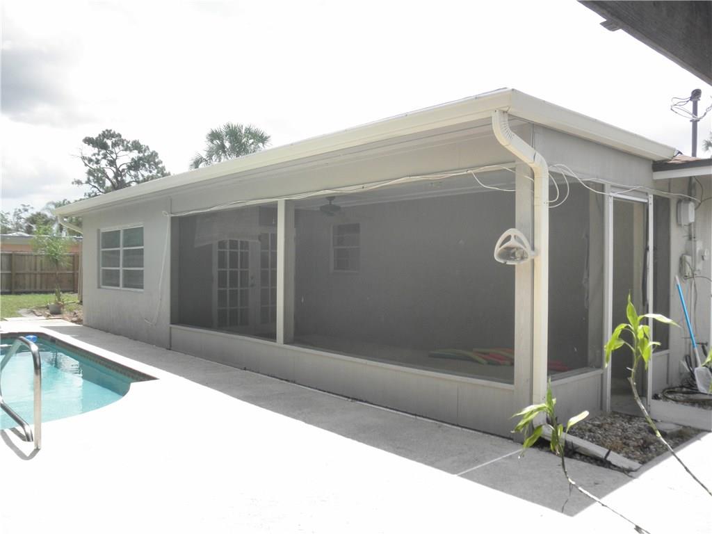 540 South Manor Drive Stuart, FL 34994 - Photo 14 of 22 a view of a house with backyard