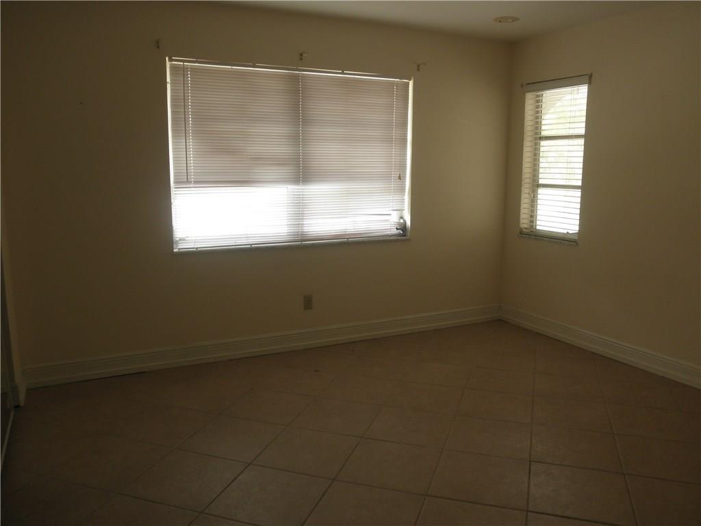 540 South Manor Drive Stuart, FL 34994 - Photo 17 of 22 an empty room with a window