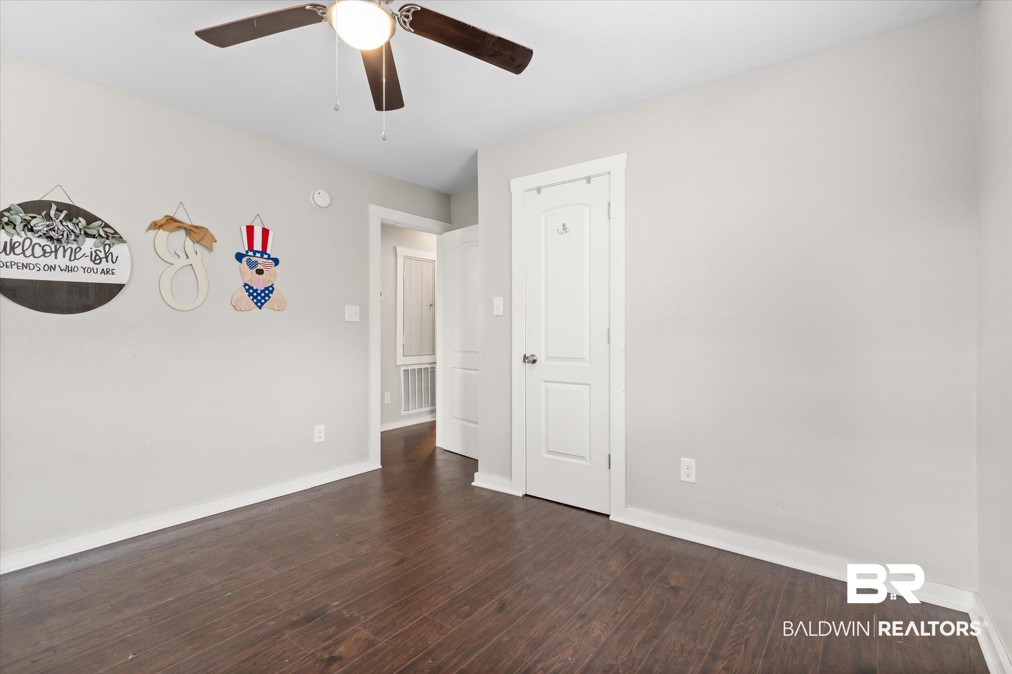419 Pierce Street Saraland, AL 36571 - Photo 13 of 21 Spare room featuring dark hardwood / wood-style floors and ceiling fan