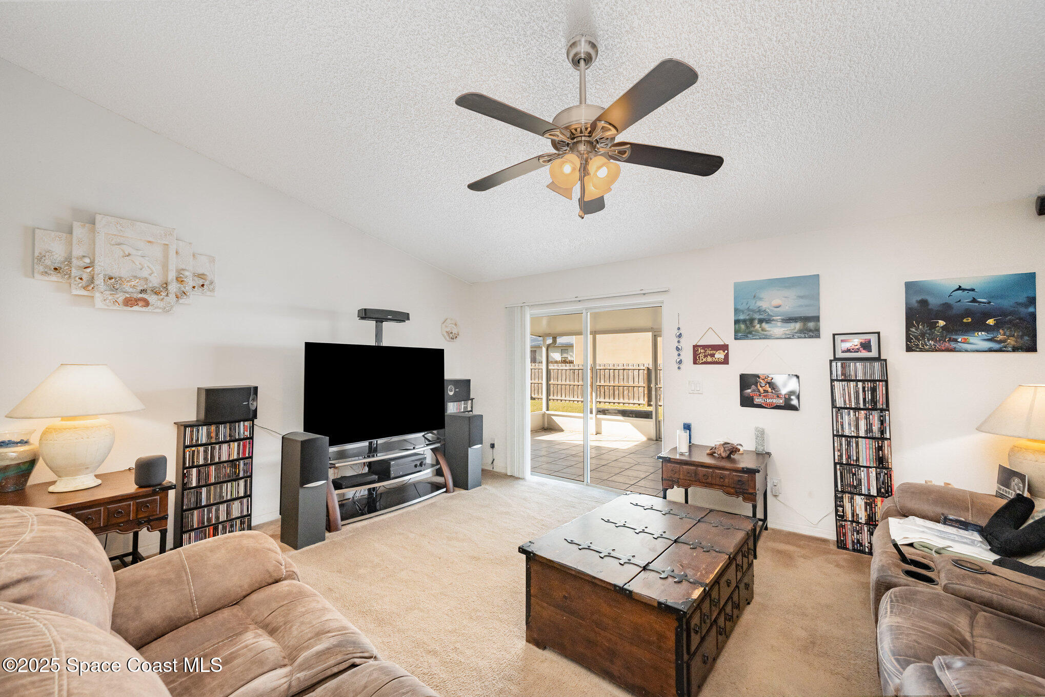 6170 Clearfield Avenue Cocoa, FL 32927 - Photo 11 of 24 a living room with furniture and a flat screen tv