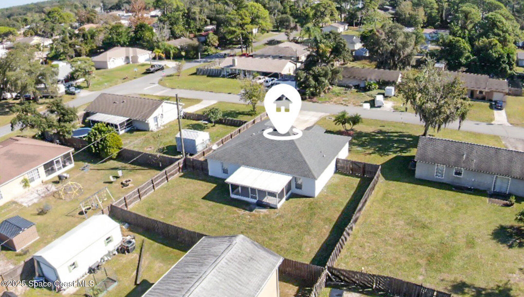 6170 Clearfield Avenue Cocoa, FL 32927 - Photo 20 of 24 an aerial view of a house with swimming pool and outdoor space