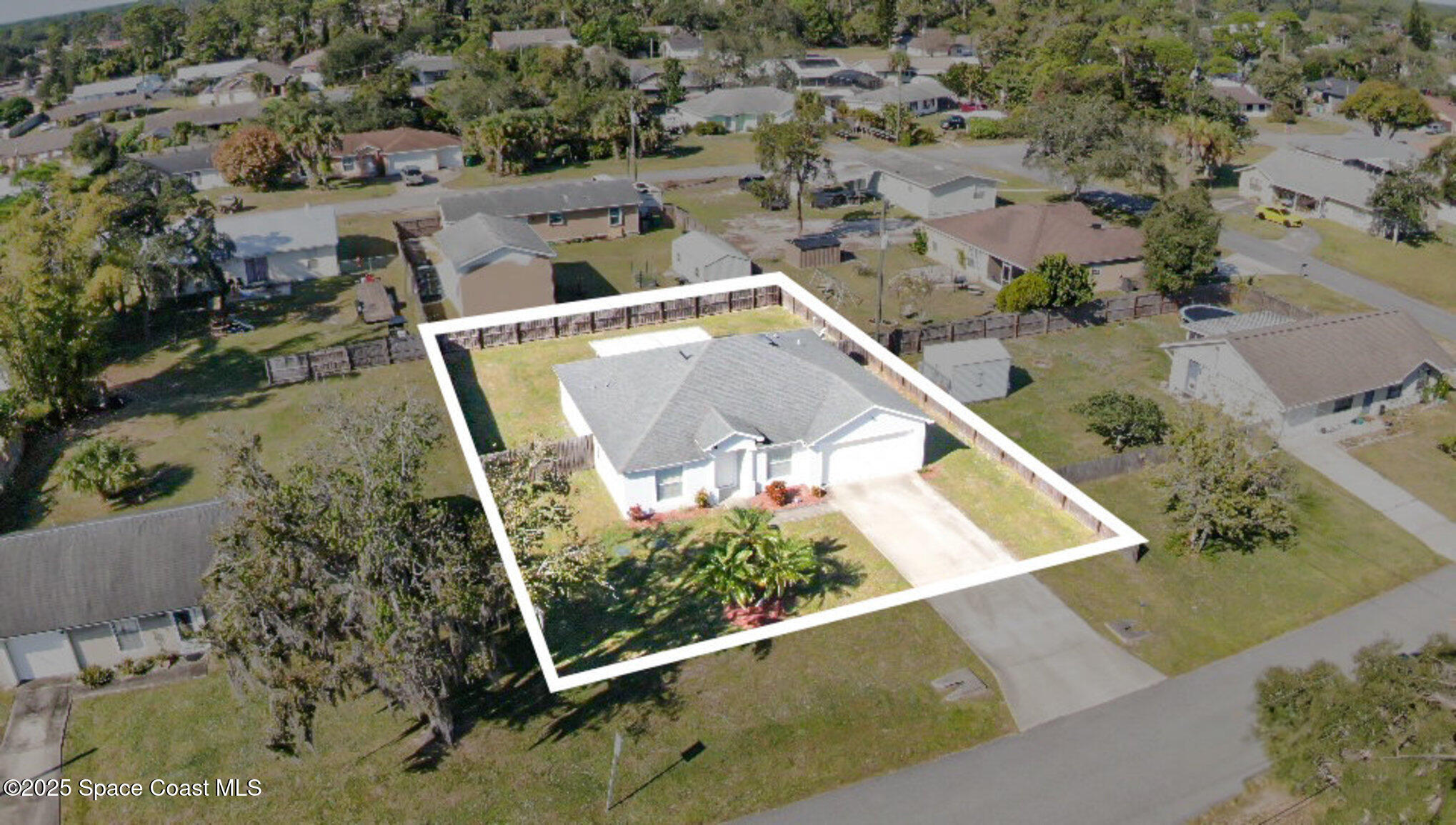 6170 Clearfield Avenue Cocoa, FL 32927 - Photo 2 of 24 an aerial view of a house with a yard