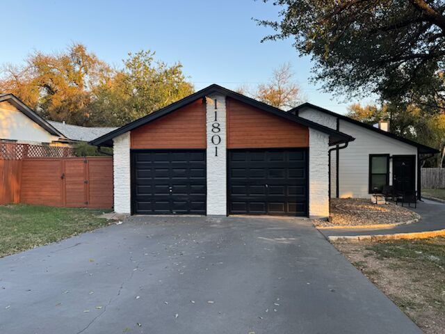 11801 Argonne Forest Trail, Unit B Austin, TX 78759 - Photo 1 of 12 a view of the house with a yard and garage