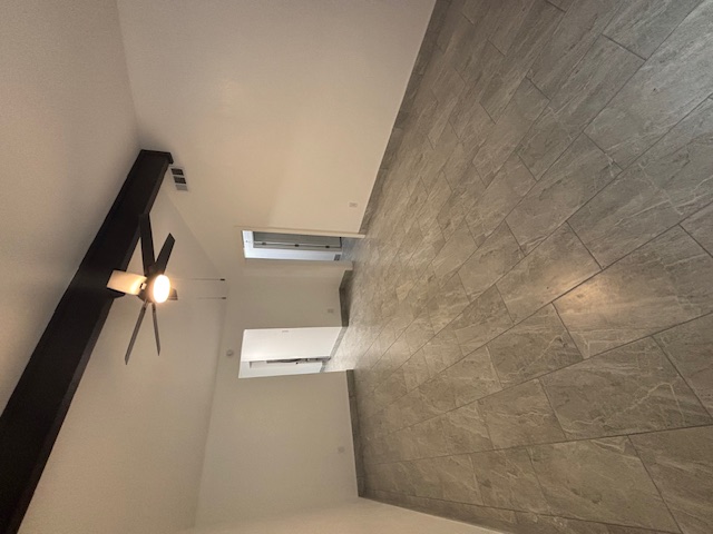 11801 Argonne Forest Trail, Unit B Austin, TX 78759 - Photo 2 of 12 a view of a livingroom with a ceiling fan and window