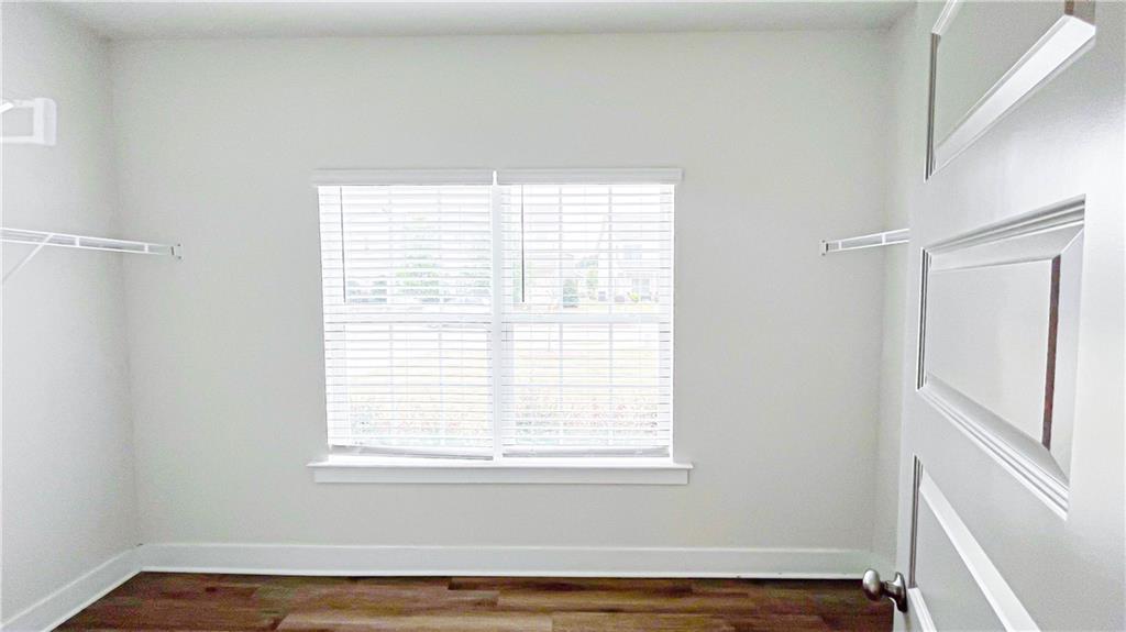 740 Eudora Welty Way Athens, GA 30607 - Photo 30 of 57 a view of an empty room with wooden floor and a window