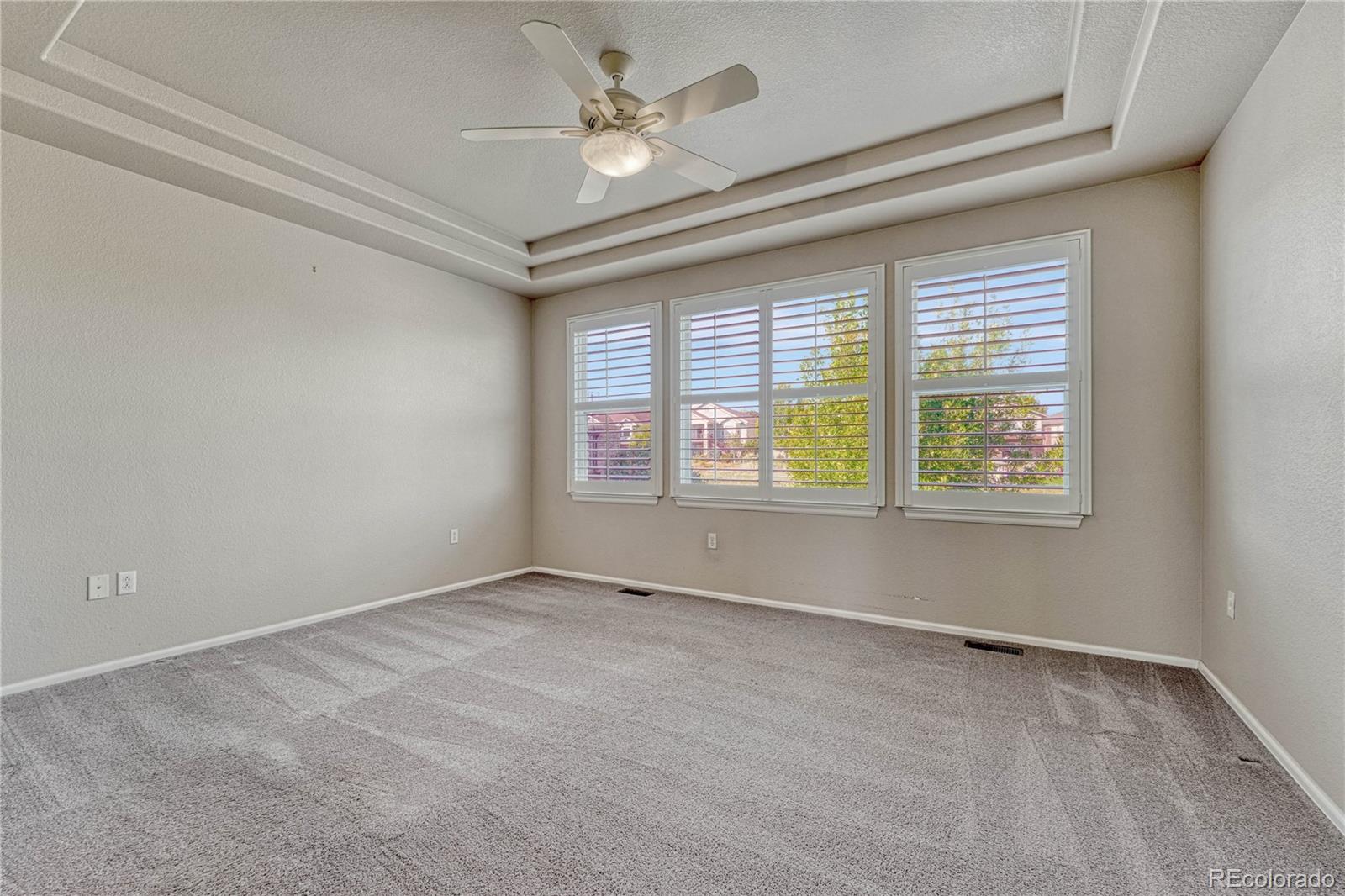 8107 South Catawba Court Aurora, CO 80016 - Photo 18 of 46 a view of an empty room with a window