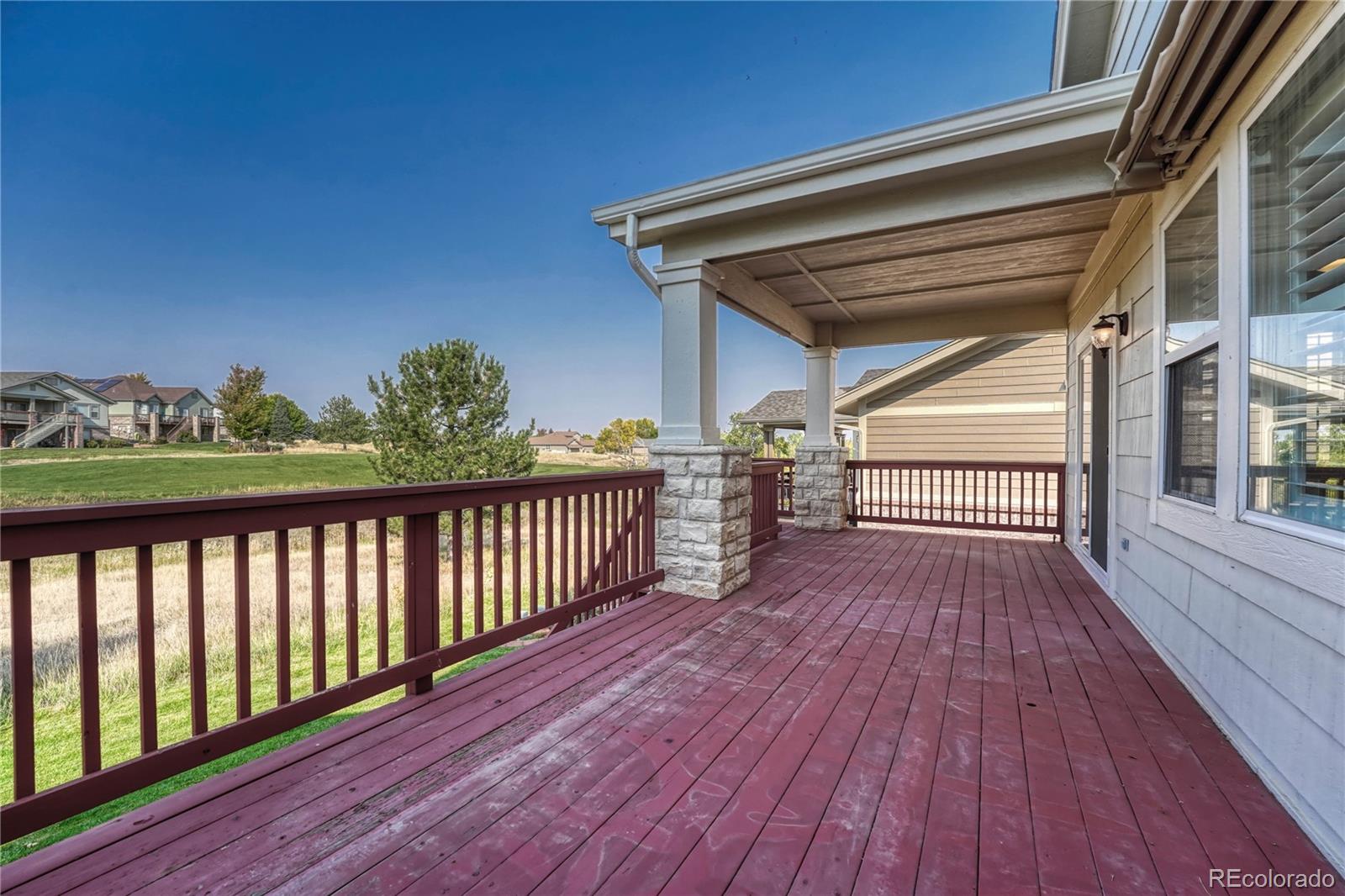 8107 South Catawba Court Aurora, CO 80016 - Photo 35 of 46 a view of balcony with wooden floor