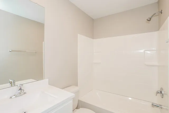 a bathroom with a sink a shower and a mirror