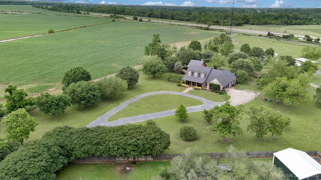 an aerial view of a house with a lake view