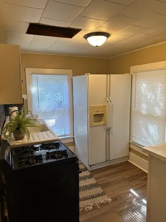 a bathroom with a toilet sink and shower