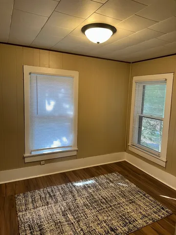 a bedroom with a bed and a fireplace