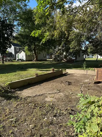 a kitchen with a refrigerator and a stove top oven
