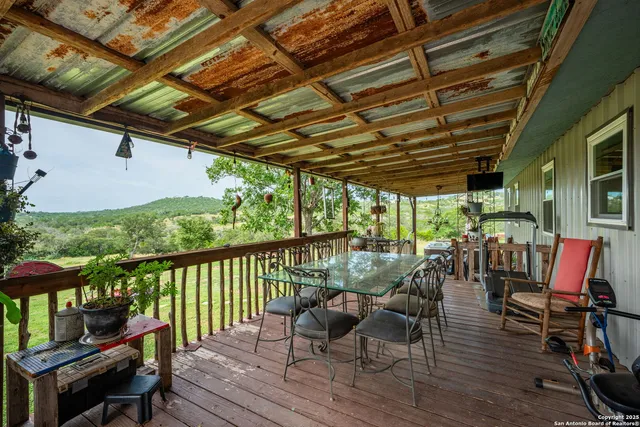 a view of a patio with wooden floor