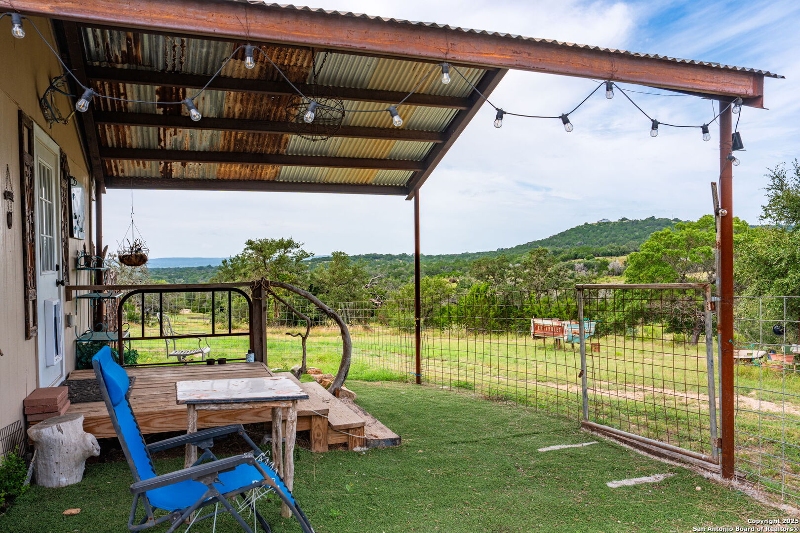 943 Stoneleigh Road Center Point, TX 78010 - Photo 22 of 36 a view of a porch with furniture and garden