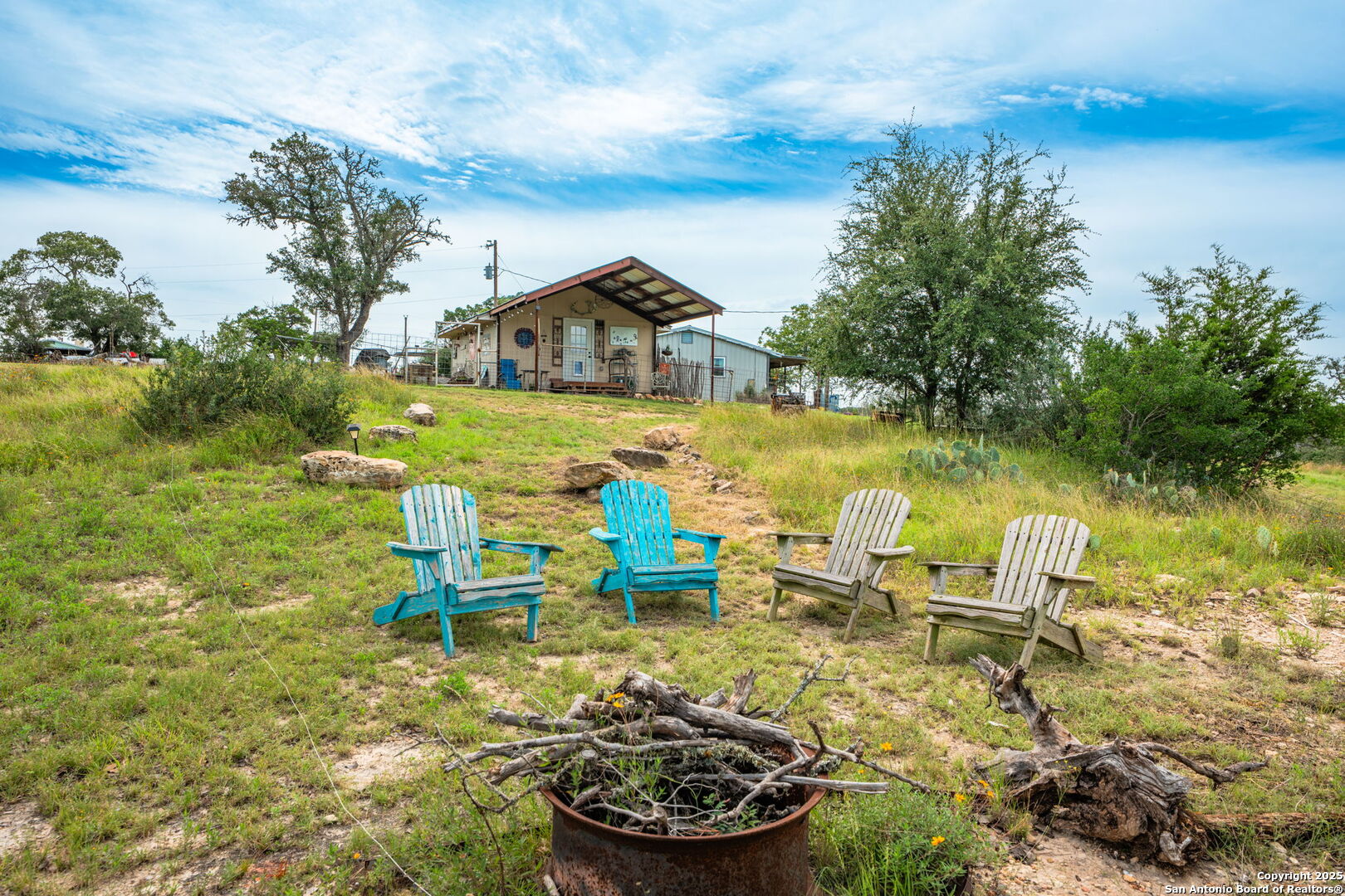 943 Stoneleigh Road Center Point, TX 78010 - Photo 23 of 36 a front view of a house with garden