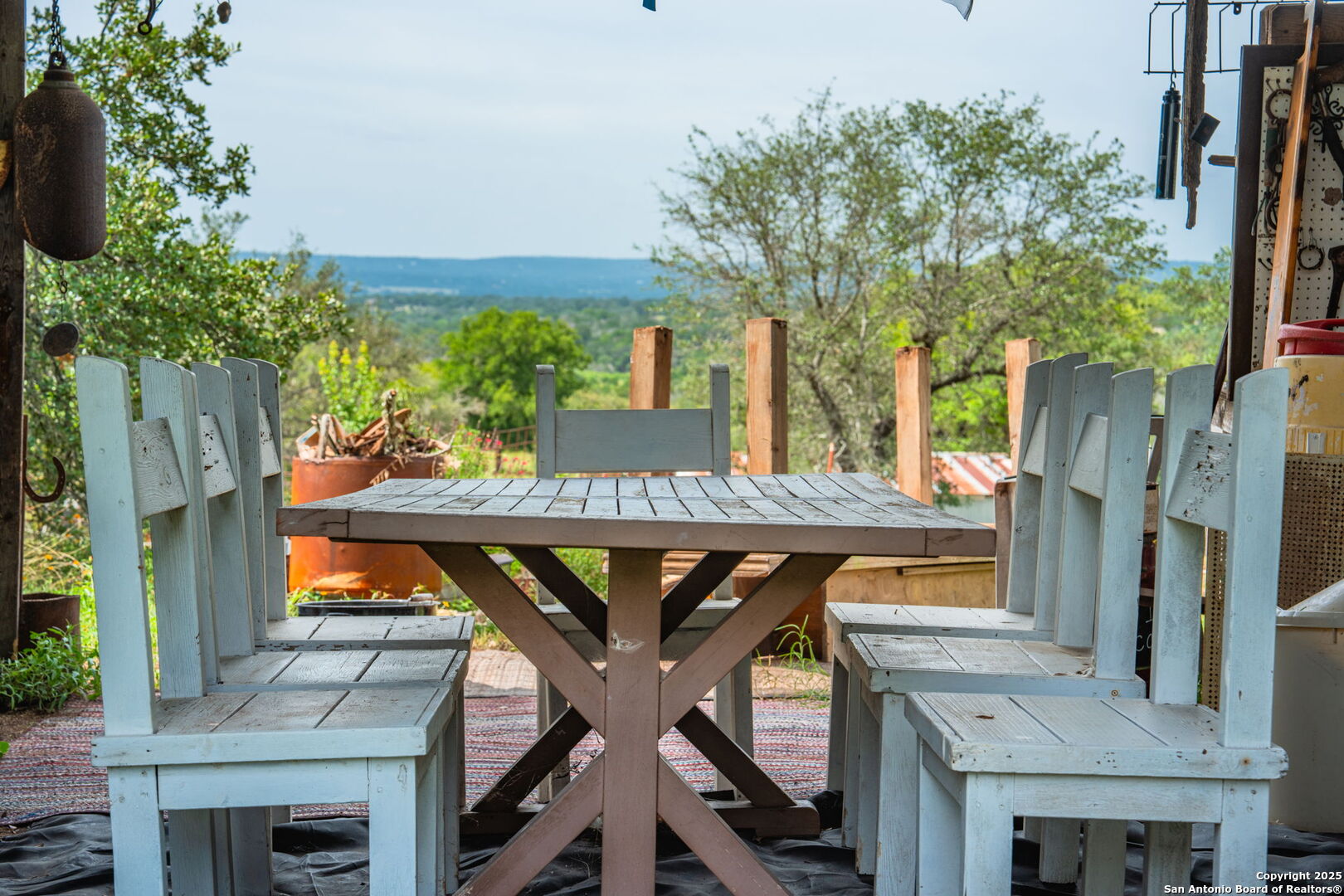 943 Stoneleigh Road Center Point, TX 78010 - Photo 25 of 36 a view of a chairs and table in the balcony