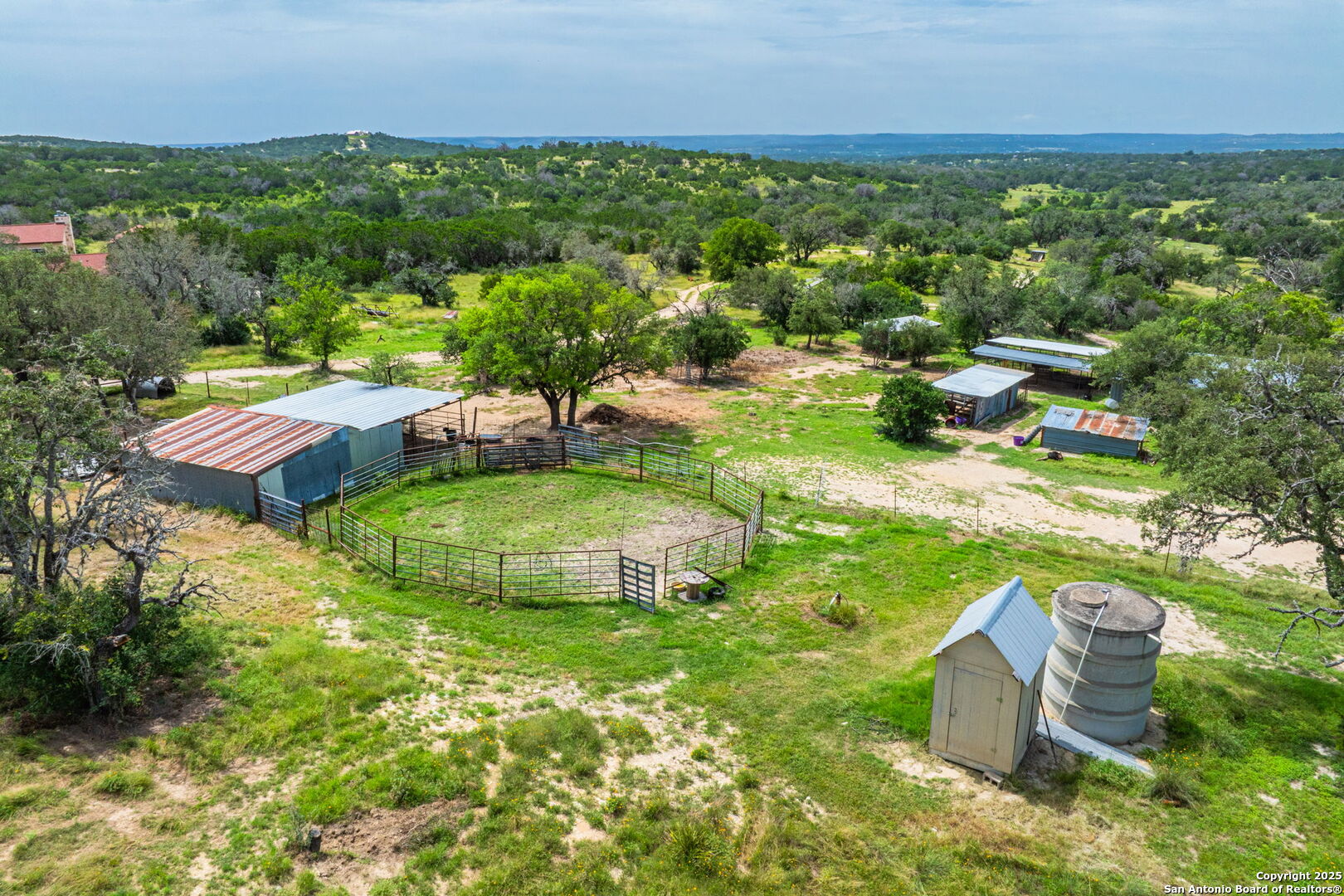 943 Stoneleigh Road Center Point, TX 78010 - Photo 29 of 36 an aerial view of a house with yard swimming pool and outdoor seating