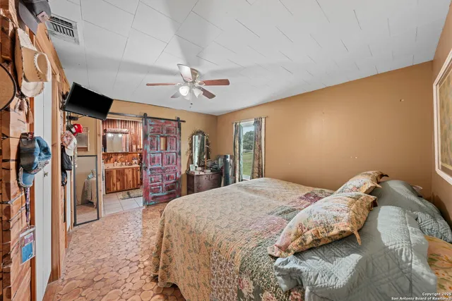 a bed room with a bed and a chandelier