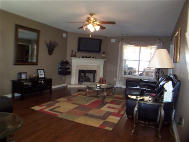 1303 River Ridge Drive Collierville, TN 38017 - Photo 2 of 12 Large living area with new hardwood floors, newly-tiled fireplace, & wired for flatscreen w/surround sound.