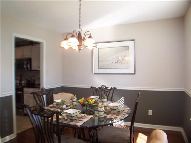1303 River Ridge Drive Collierville, TN 38017 - Photo 5 of 12 Dining room also includes wood floors & new fixtures.