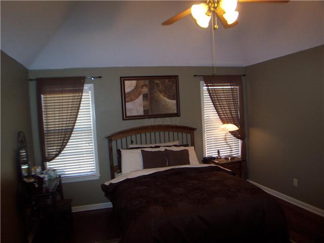 1303 River Ridge Drive Collierville, TN 38017 - Photo 6 of 12 Master bedroom also has wood floors and is wired for flat screen.