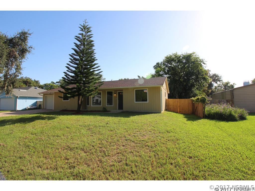 2007 Orange Tree Drive Edgewater, FL 32141 - Photo 1 of 23 a house with yard in front of it