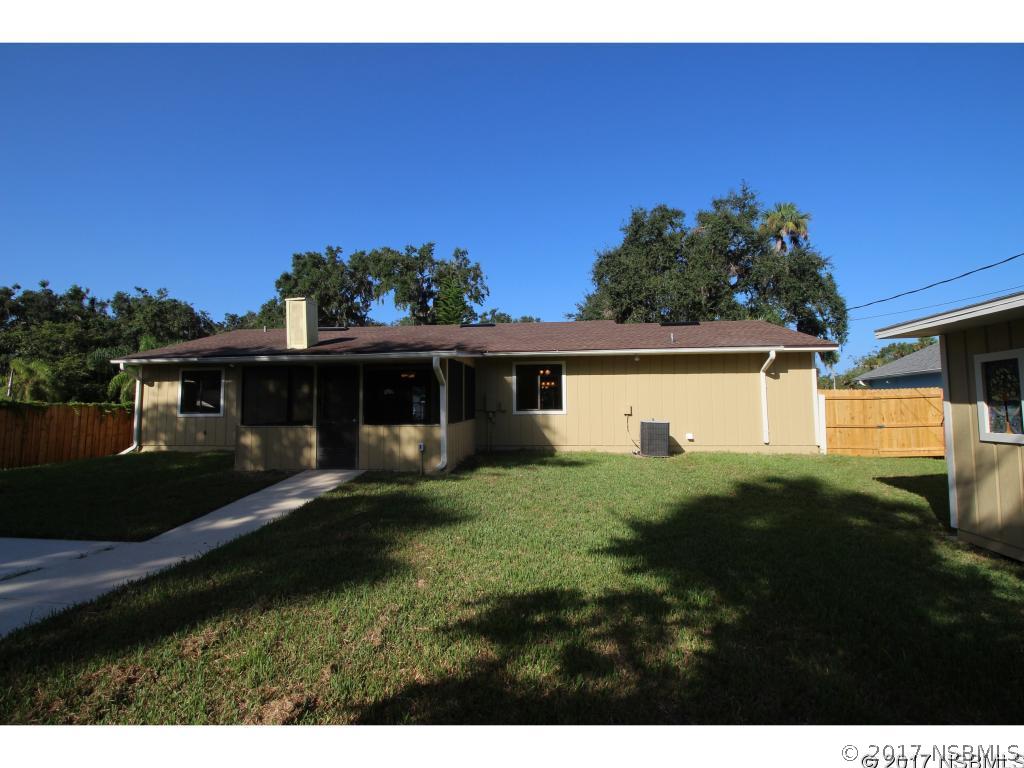 2007 Orange Tree Drive Edgewater, FL 32141 - Photo 18 of 23 a view of a yard in front of a house with a large tree